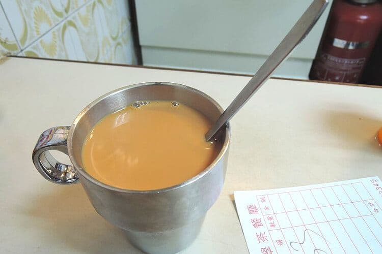 Coffee in a metal cup in Hong Kong.